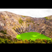 irazu volcano crater with some cloulds on top
 - Costa Rica
